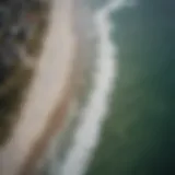 Aerial view showcasing the shoreline at Inlet Beach with dynamic water patterns