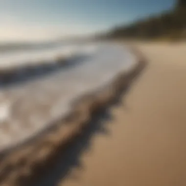 Close-up of coastal erosion affecting the sandy beach area