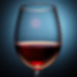 A close-up of a wine glass highlighting its rich color and clarity